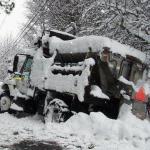 photo by Harold Griffith of a snow plow off the road in Raleigh Co.